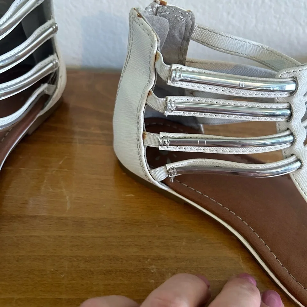 Youth size, one justice, gladiator, white, and silver sandals